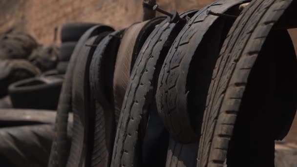 Close Black Wheel Tires Cut Stripes Recycling Materials — Stock Video