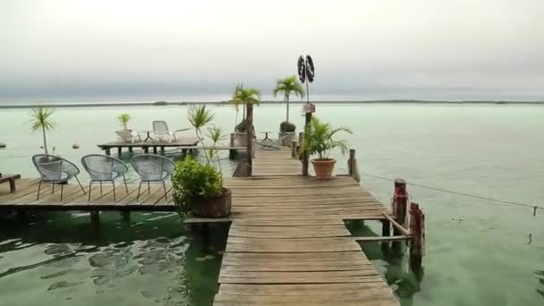 Caribbean Luxury Wooden Pier Ocean Green Plants Pots Chairs — Vídeo de stock