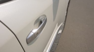 Toyota V6 white jeep exterior, car details, steel door handle with a button..