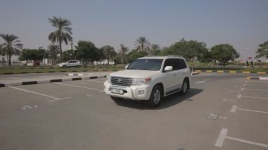 Toyota V6 white jeep exterior, camera smooth zoom in front part of car...