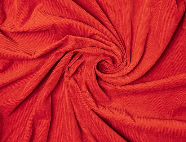 Textil y tela concepto de fondo. Textura de tela de terciopelo naranja. Textura suave con arrugas en espiral. Vista superior — Foto de Stock