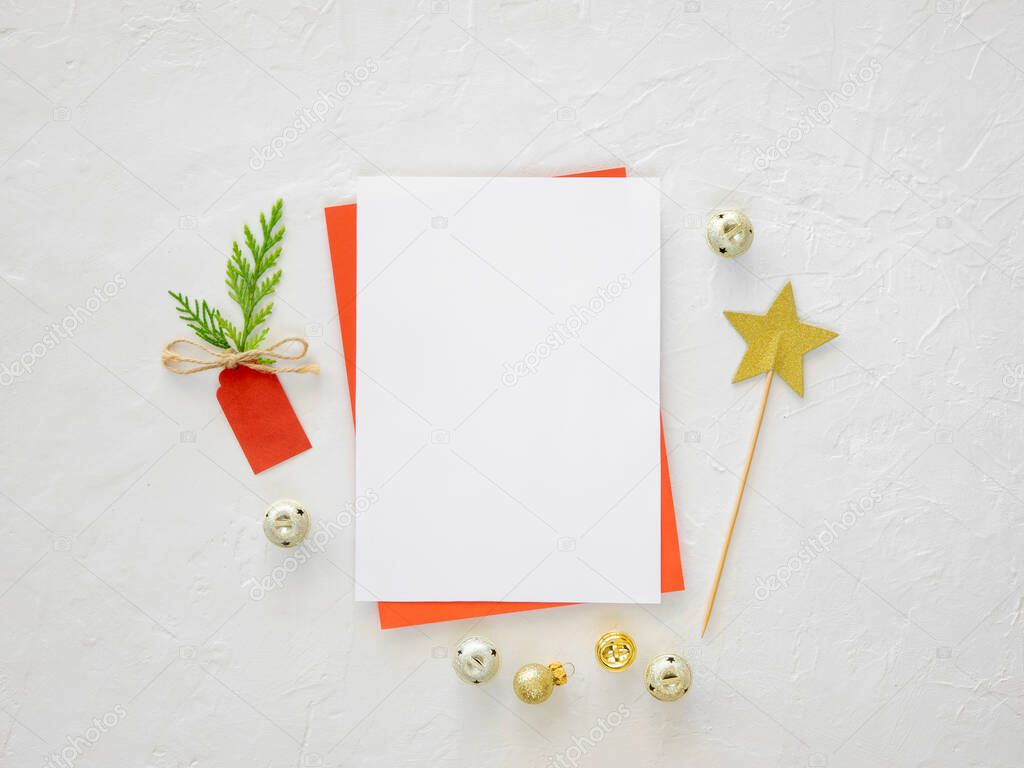 Christmas wish list or card and xmas decorations on the white background. Copy space mockup flat lay for winter sale or promo banner