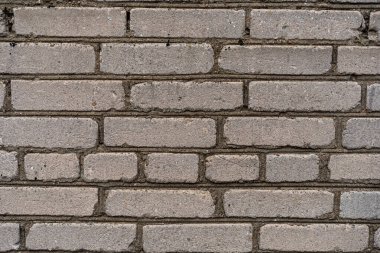 Eski, kirli, beyaz ve gri tuğla duvar arka planının yıpranmış dokusu. Bina. Boşluğu kopyala.