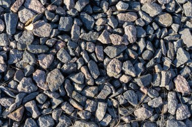 Grinin farklı tonlarında çok sayıda taşın fotoğrafı. Soyut doğa arka plan kavramı.