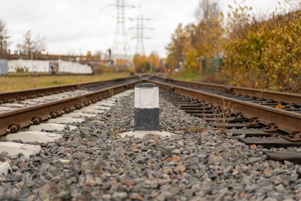 Photo Old Railway Gray Stones Next Black White Column Train — Stock Photo, Image