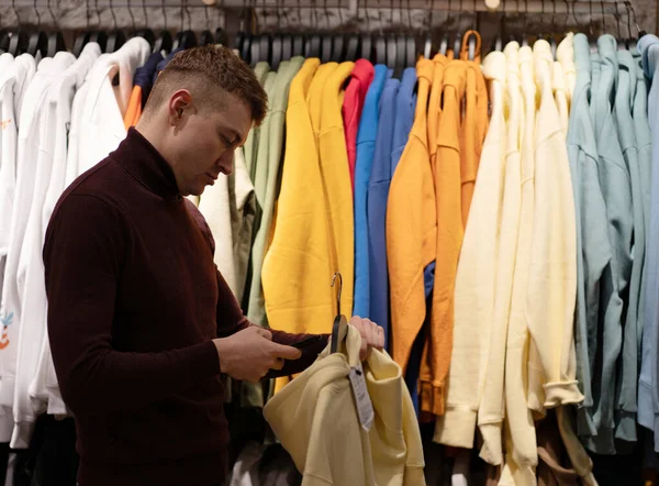 Photo Man Choosing Clothes Himself Shopping Center Stock Image