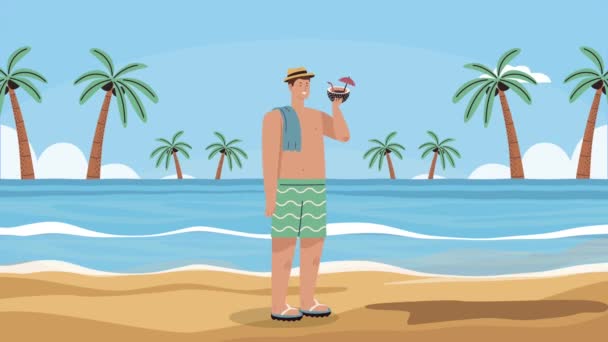 Mladý muž pije kokosový koktejl na pláži — Stock video
