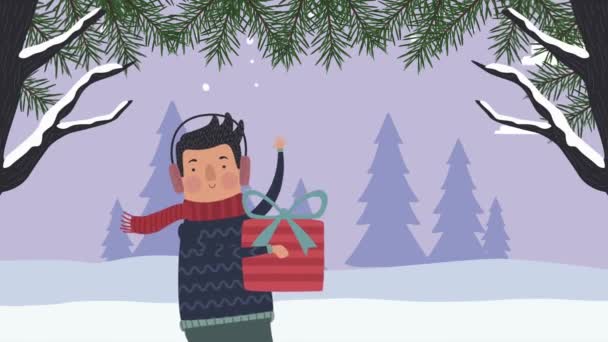 Молодий чоловік з подарунковою снігопадовою сценою — стокове відео