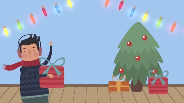 Joven con regalo y árbol de Navidad — Vídeos de Stock