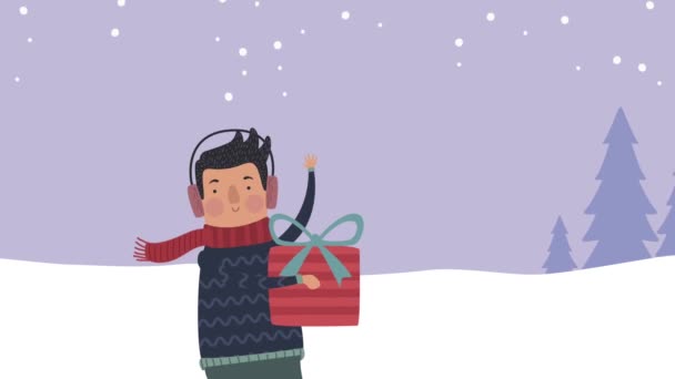 Mladý muž s dárkem ve sněhové krajině — Stock video