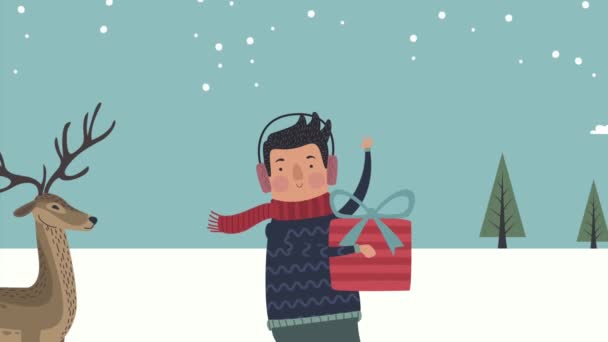 Young man with gift and reindeer — Vídeo de Stock