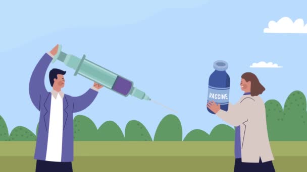 Wetenschappers koppelen met injectieflacon met vaccin en spuit — Stockvideo
