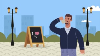 Kahve dükkanındaki adam içki ve karatahta içiyor.