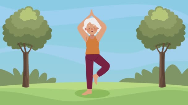 Grandmother practicing exercise in the camp — Stock Video