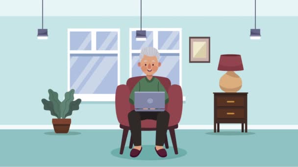 Παππούς χρησιμοποιώντας φορητό υπολογιστή σε καναπέ animation — Αρχείο Βίντεο