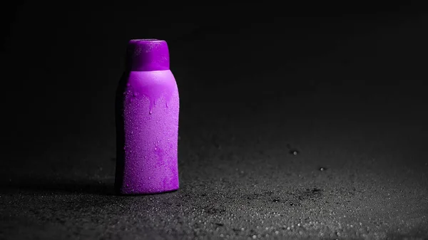 Pink Plastic Bottle Black Background — Stockfoto