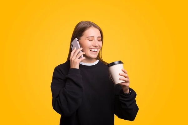 Laughing Young Woman Talking Phone While Enjoying Her Coffee Yellow — Stock Photo, Image