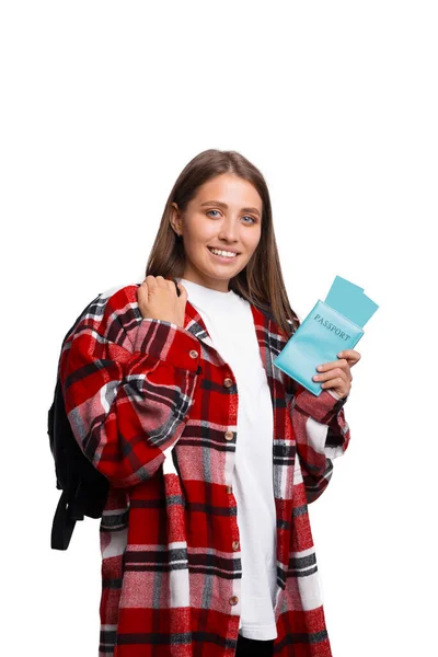 Happy young traveler woman holding passport and tickets isolated on white — Stock Photo, Image