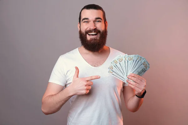 Happy Man Pointing Bunch Money Holding Studio Shot Grey Background — Stock Photo, Image