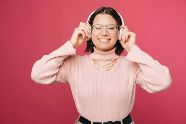 Young Woman Eyes Closed Wearing White Earphones Touching Them Both — 스톡 사진