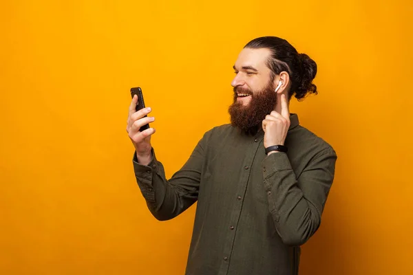 Man Listens Music Audio Book Phone Touches Ear Pod Studio — Stock Photo, Image