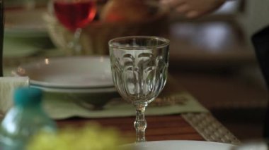 Close up video of barman pouring fresh juice in glass.