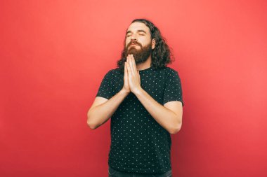 A photo of a young man praying about something he wishes