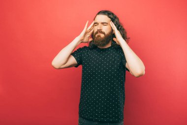 A picture of a man having a headache 