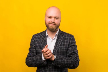 A photo of a nice young business man looking cheerfuly at the camera