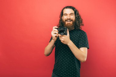 A portrait of a photographer smiling at the camera