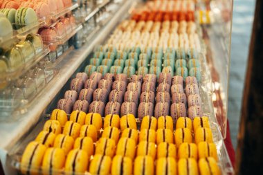 A nice photo of some macaroons standing at the window