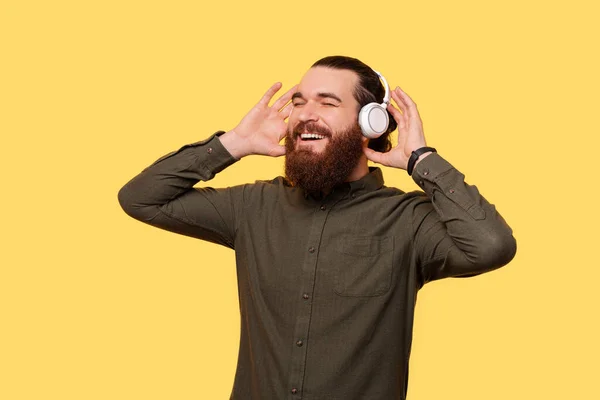 Bearded Man Joyfuly Enjoying Music Listens His New Headphones — Photo