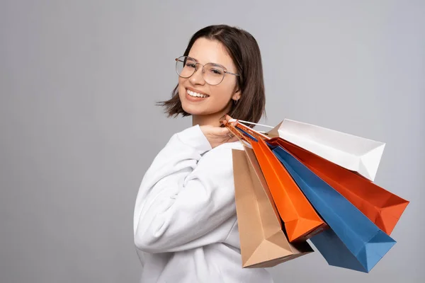 Calm Young Lady Wearing Glasses White Sweatshirt Smiles While Holding — Φωτογραφία Αρχείου