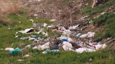Footage of trash on hills, pollution problem.