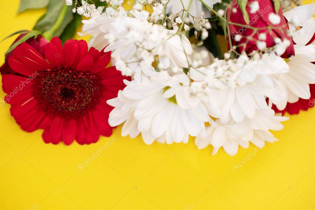 bouquet with chrysanthemums and gerbera, flowers on a yellow background, macro photo
