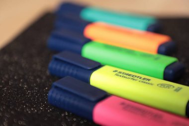 close up of a colored pencil on a white background