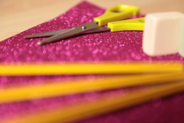 colorful sewing tools on a wooden table