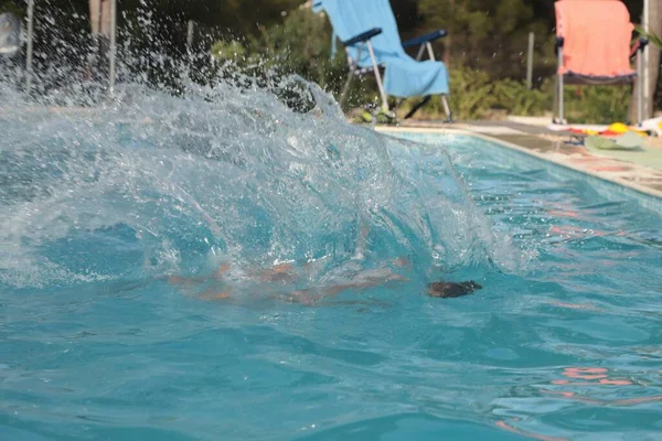 water splashing in summer pool