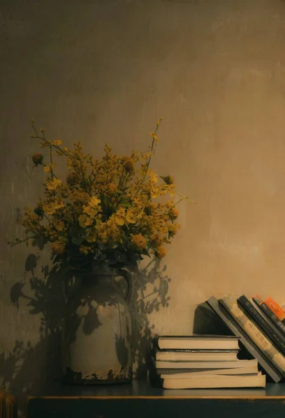 still life with a bouquet of flowers and a book