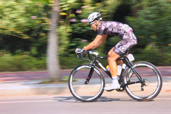 young man riding bicycle in the forest