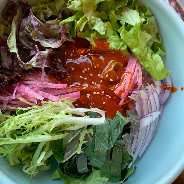 salad with red cabbage and green leaves