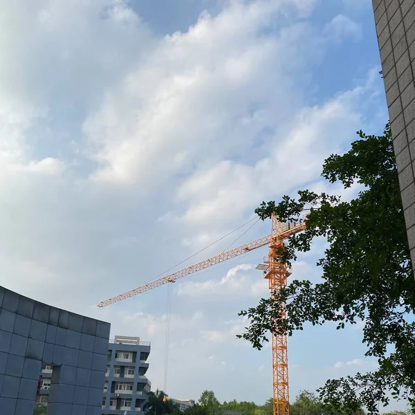construction of a building against a background of a skyscraper
