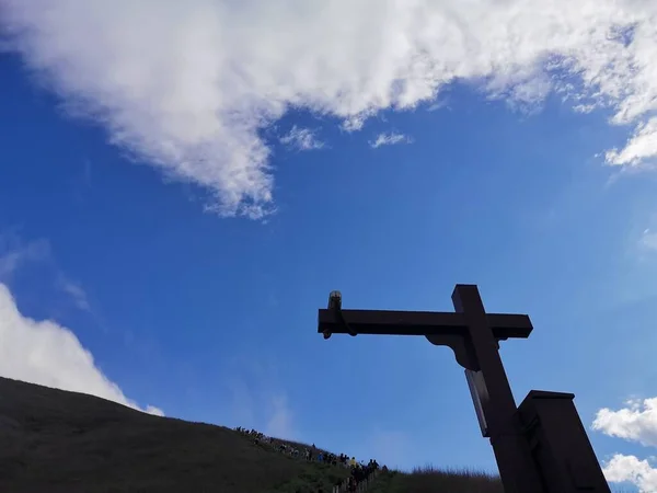 cross-shaped sign on the sky