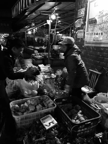 black and white image of a food market
