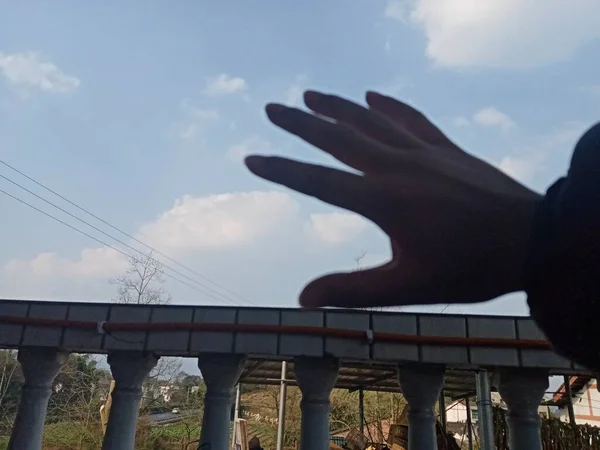 hand holding a bridge in the city