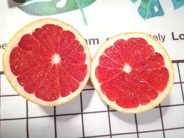 fresh red grapefruit on a white background