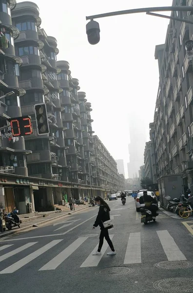 man in suit walking on the street