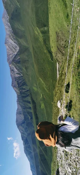 a man is climbing the mountain river