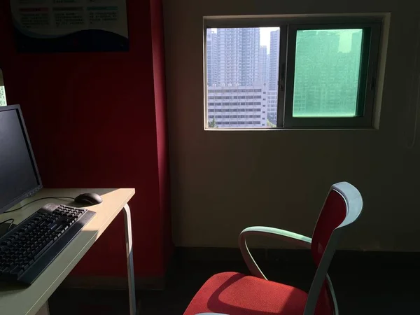 modern office room with computer and a chair