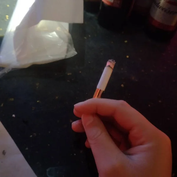 close up of a person smoking cigarette